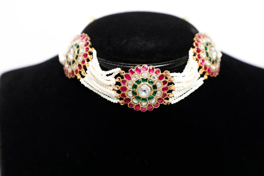 925 Silver Hand made Meena work neck choker weaved in natural cultured pearls studded with Kundan and finished with pure 22karat yellow gold