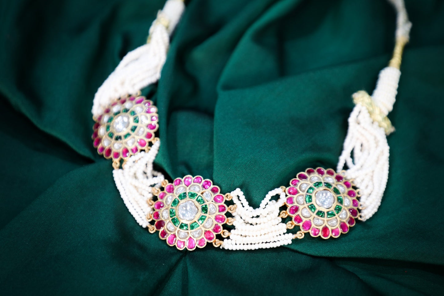 925 Silver Hand made Meena work neck choker weaved in natural cultured pearls studded with Kundan and finished with pure 22karat yellow gold